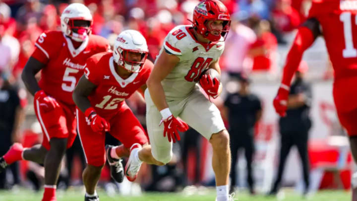Cam Barmore running downfield after completing a catch against Houston
