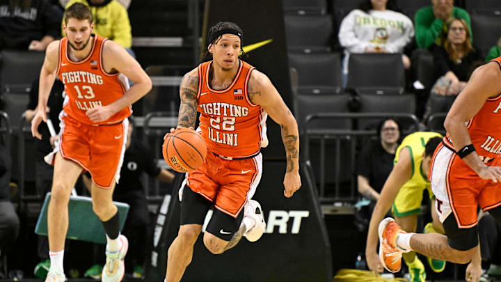 Jan 2, 2025; Eugene, Oregon, USA; Illinois Fighting Illini guard Tre White (22) runs a fast break against the Oregon Ducks during the second half at Matthew Knight Arena. Mandatory Credit: Craig Strobeck-Imagn Images