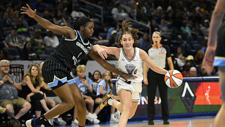 Aug 15, 2025; Chicago, Illinois, USA;  Golden State Valkyries guard Carla Leite (0) drives to the basket against Chicago Sky center Elizabeth Williams (1) during the second half at Wintrust Arena. Mandatory Credit: Matt Marton-Imagn Images
