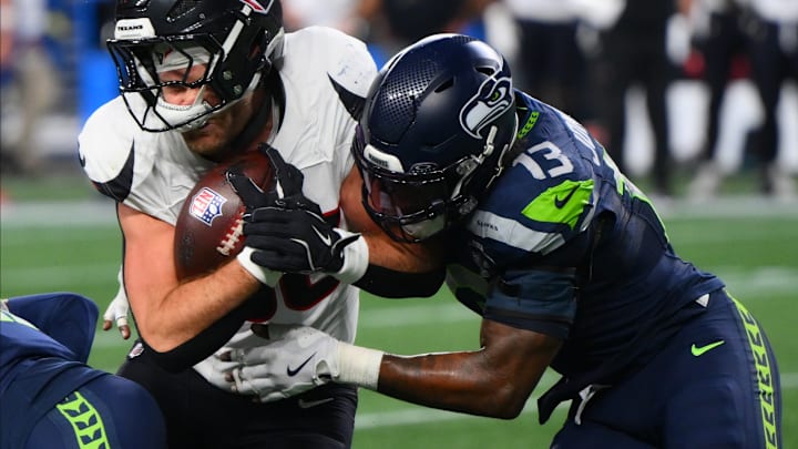 Oct 20, 2025; Seattle, Washington, USA; Seattle Seahawks linebacker Ernest Jones IV (13) tackles Houston Texans tight end Dalton Schultz (86) during the second quarter at Lumen Field. Oct 20, 2025; Seattle, Washington, USA; Seattle Seahawks linebacker Ernest Jones IV (13) tackles Houston Texans tight end Dalton Schultz (86) during the second quarter at Lumen Field.
