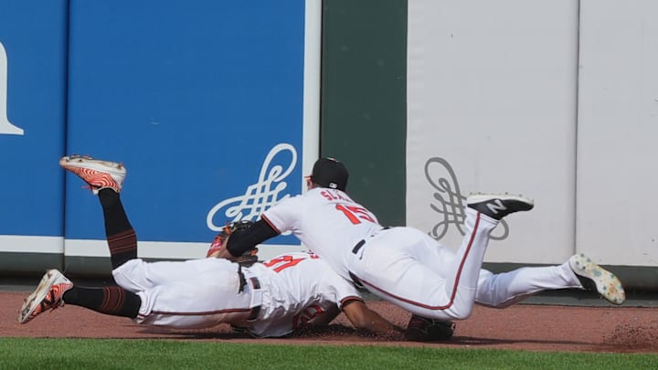 Sep 19, 2024; Baltimore, Maryland, USA; Baltimore Orioles outfielders Cedric Mullins (31) and Austin Slater (15) run into each other attempting to catch a ball in the ninth inning against the San Francisco Giants at Oriole Park at Camden Yards. Sep 19, 2024; Baltimore, Maryland, USA; Baltimore Orioles outfielders Cedric Mullins (31) and Austin Slater (15) run into each other attempting to catch a ball in the ninth inning against the San Francisco Giants at Oriole Park at Camden Yards.