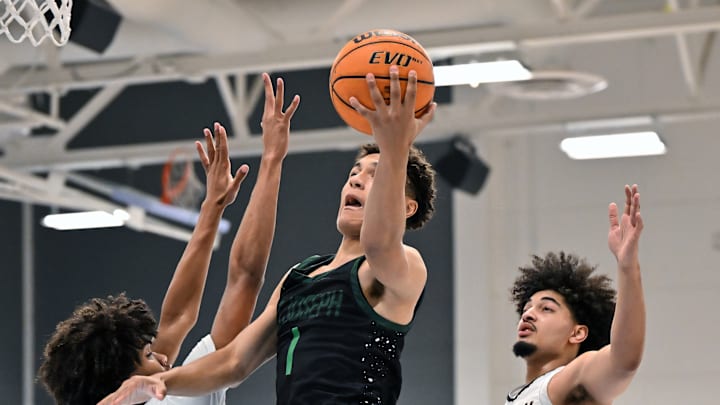 Julius Price, of No. 3 St. Joseph-Santa Maria, swoops in for two of his 16 points in Saturday's 76-67 win over No. 9 Salesian in the Crush in the Valley Showcase in San Pablo Calif. Price and his brother Malcolm are at least two Knights on the list as well as three Salesian players heading into Monday's MLK Classic at De La Salle.