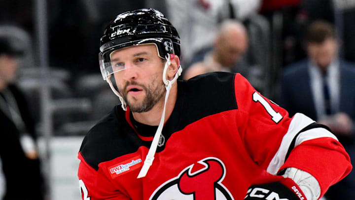 Oct 22, 2025; Newark, New Jersey, USA; New Jersey Devils center Luke Glendening (14) warms up before a game against the Minnesota Wild at Prudential Center. Mandatory Credit: John Jones-Imagn Images