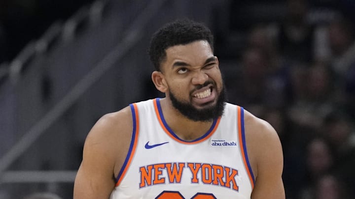 Mar 28, 2025; Milwaukee, Wisconsin, USA; New York Knicks center Karl-Anthony Towns (32) reacts after running into a Milwaukee Bucks player while driving to the basket in the first half at Fiserv Forum. Mar 28, 2025; Milwaukee, Wisconsin, USA; New York Knicks center Karl-Anthony Towns (32) reacts after running into a Milwaukee Bucks player while driving to the basket in the first half at Fiserv Forum.