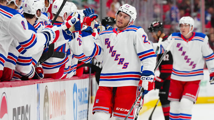 Nov 27, 2024; Raleigh, North Carolina, USA;  New York Rangers center Jonny Brodzinski (22) celebrates his goal against the Carolina Hurricanes during the first period at Lenovo Center. Mandatory Credit: James Guillory-Imagn Images