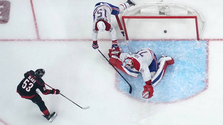 May 29, 2026; Raleigh, North Carolina, USA; Carolina Hurricanes right wing Jackson Blake (53) scores an even strength goal against Montreal Canadiens goaltender Jakub Dobes (75) and center Alex Newhook (15) in game five of the Eastern Conference Final of the 2026 Stanley Cup Playoffs during the second period at Lenovo Center. Mandatory Credit: James Guillory-Imagn Images May 29, 2026; Raleigh, North Carolina, USA; Carolina Hurricanes right wing Jackson Blake (53) scores an even strength goal against Montreal Canadiens goaltender Jakub Dobes (75) and center Alex Newhook (15) in game five of the Eastern Conference Final of the 2026 Stanley Cup Playoffs during the second period at Lenovo Center. Mandatory Credit: James Guillory-Imagn Images