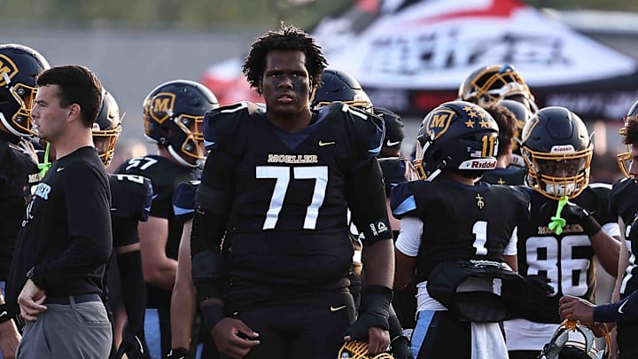 Moeller offensive lineman Kalel Johnson (77) gets ready on the field before their football game against St. Xavier Friday, Sept. 19, 2025. Moeller offensive lineman Kalel Johnson (77) gets ready on the field before their football game against St. Xavier Friday, Sept. 19, 2025.