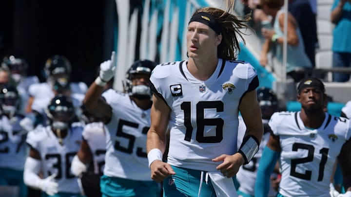 Jacksonville Jaguars quarterback Trevor Lawrence (16) runs out to the field with his teammates. Jacksonville Jaguars quarterback Trevor Lawrence (16) runs out to the field with his teammates.