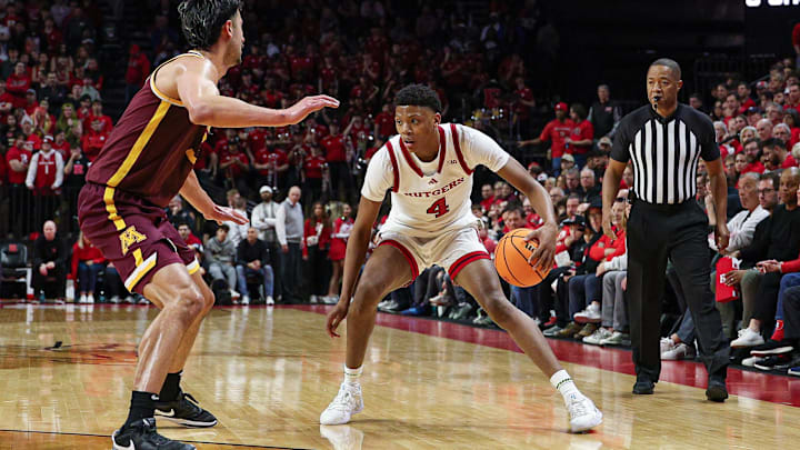 Mar 9, 2025; Piscataway, New Jersey, USA; Rutgers Scarlet Knights guard Ace Bailey (4) is defended by Minnesota Golden Gophers forward Dawson Garcia (3) during the second half at Jersey Mike's Arena. Mandatory Credit: Vincent Carchietta-Imagn Images