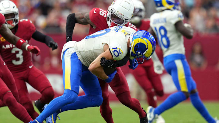 Arizona Cardinals cornerback Max Melton (16) tackles Los Angeles Rams receiver Cooper Kupp (10) at State Farm Stadium.