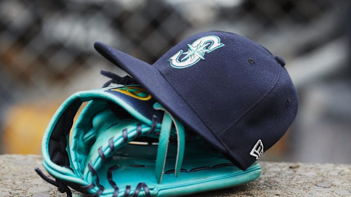 Hat and glove of Seattle Mariners center fielder Dee Gordon (9) sits in dugout during the third inning against the Detroit Tigers at Comerica Park in 2018.