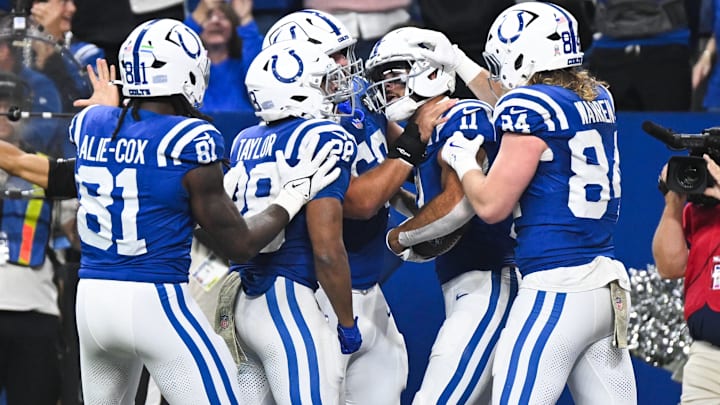 Oct 26, 2025; Indianapolis, Indiana, USA; Indianapolis Colts wide receiver Michael Pittman Jr. (11) celebrates with teammates after scoring a touchdown during the second quarter against the Tennessee Titans at Lucas Oil Stadium. Mandatory Credit: Robert Goddin-Imagn Images Oct 26, 2025; Indianapolis, Indiana, USA; Indianapolis Colts wide receiver Michael Pittman Jr. (11) celebrates with teammates after scoring a touchdown during the second quarter against the Tennessee Titans at Lucas Oil Stadium. Mandatory Credit: Robert Goddin-Imagn Images