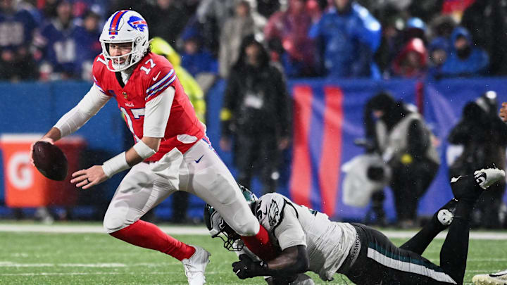 Philadelphia Eagles’ linebacker Jaelan Phillips (50) and Buffalo Bills’ quarterback Josh Allen (17).