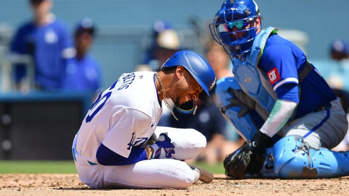 Los Angeles Dodgers shortstop Mookie Betts reacts after being hit by pitch from Kansas City Royals pitcher Dan Altavilla.