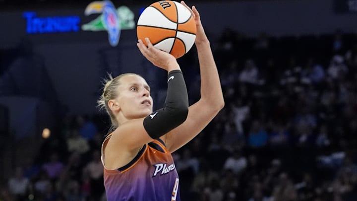 Jul 16, 2025; Minneapolis, Minnesota, USA; Phoenix Mercury guard Kitija Laksa (9) shoots against the Minnesota Lynx in the third quarter at Target Center. Mandatory Credit: Bruce Kluckhohn-Imagn Images