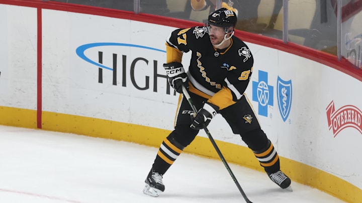 Apr 8, 2025; Pittsburgh, Pennsylvania, USA;  Pittsburgh Penguins center Sidney Crosby (87) skates with the puck against the Chicago Blackhawks during the second period at PPG Paints Arena. Mandatory Credit: Charles LeClaire-Imagn Images