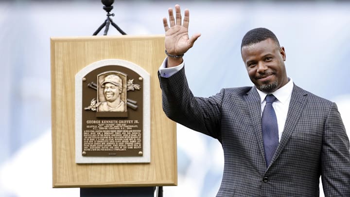 Aug 6, 2016; Seattle, WA, USA; Seattle Mariners former player Ken Griffey Jr. smiles next to his Hall of Fame plaques during his number retirement ceremony before the start of a game against the Los Angeles Angels at Safeco Field.