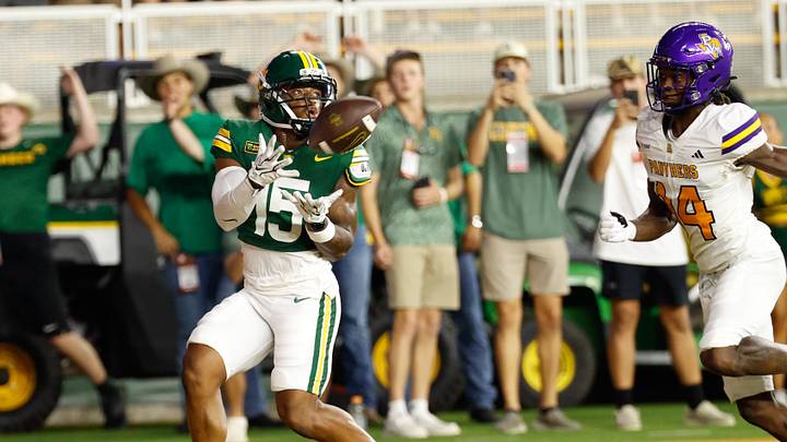 Sep 12, 2026; Waco, Texas, USA; Baylor Bears wide receiver Jayden McGowan (15) catches a pass for a touchdown against Prairie View A&M Panthers defensive back Fitzroy Ledgister (14) during the first half at McLane Stadium. Mandatory Credit: Chris Jones-Imagn Images Sep 12, 2026; Waco, Texas, USA; Baylor Bears wide receiver Jayden McGowan (15) catches a pass for a touchdown against Prairie View A&M Panthers defensive back Fitzroy Ledgister (14) during the first half at McLane Stadium. Mandatory Credit: Chris Jones-Imagn Images