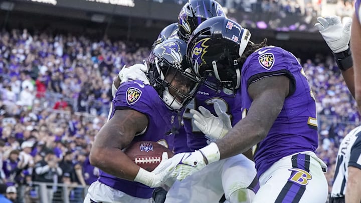 Nov 5, 2023; Baltimore, Maryland, USA; Baltimore Ravens running back Keaton Mitchell (34) celebrates his touchdown against the Seattle Seahawks with running back Justice Hill (43) and running back Gus Edwards (35) during the third quarter at M&T Bank Stadium. Mandatory Credit: Jessica Rapfogel-Imagn Images Nov 5, 2023; Baltimore, Maryland, USA; Baltimore Ravens running back Keaton Mitchell (34) celebrates his touchdown against the Seattle Seahawks with running back Justice Hill (43) and running back Gus Edwards (35) during the third quarter at M&T Bank Stadium. Mandatory Credit: Jessica Rapfogel-Imagn Images