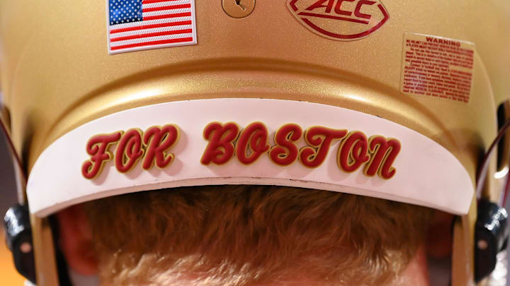 Nov 3, 2023; Syracuse, New York, USA; Detailed view of the back of a Boston College Eagles helmet saying    For Boston    prior to the game against the Syracuse Orange at the JMA Wireless Dome. Mandatory Credit: Rich Barnes-Imagn Images