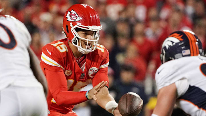 Oct 12, 2023; Kansas City, Missouri, USA; Kansas City Chiefs quarterback Patrick Mahomes (15) receives the snap against the Denver Broncos during the game at GEHA Field at Arrowhead Stadium. Mandatory Credit: Denny Medley-Imagn Images