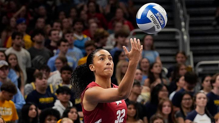 Wisconsin Badgers outside hitter Grace Egan (32) prepares to serve the ball during the first set of the match against the Marquette Golden Eagles on Wednesday September 17, 2025 at Fiserv Forum in Milwaukee, Wisconsin.