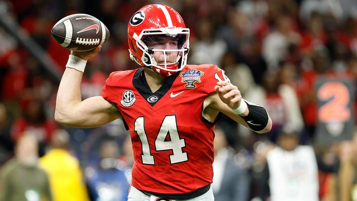 Jan 1, 2026; New Orleans, LA, USA; Georgia Bulldogs quarterback Gunner Stockton (14) passes the ball against the Mississippi Rebels in the second quarter during the 2026 Sugar Bowl and quarterfinal game of the College Football Playoff at Caesars Superdome. Mandatory Credit: Amber Searls-Imagn Images