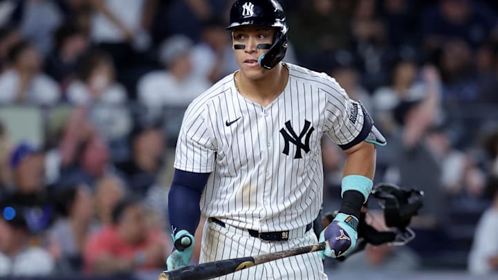 Jun 9, 2024; Bronx, New York, USA; New York Yankees right fielder Aaron Judge (99) reacts after hitting a solo home run against the Los Angeles Dodgers during the eighth inning at Yankee Stadium. Mandatory Credit: Brad Penner-USA TODAY Sports