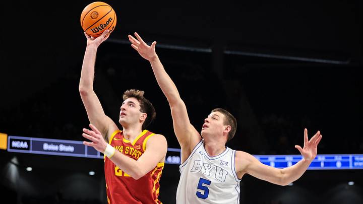Mar 13, 2025; Kansas City, MO, USA; Iowa State Cyclones forward Milan Momcilovic (22) shoots the ball around Brigham Young Cougars forward Mihailo Boskovic (5) during the second half at T-Mobile Center. Mar 13, 2025; Kansas City, MO, USA; Iowa State Cyclones forward Milan Momcilovic (22) shoots the ball around Brigham Young Cougars forward Mihailo Boskovic (5) during the second half at T-Mobile Center.
