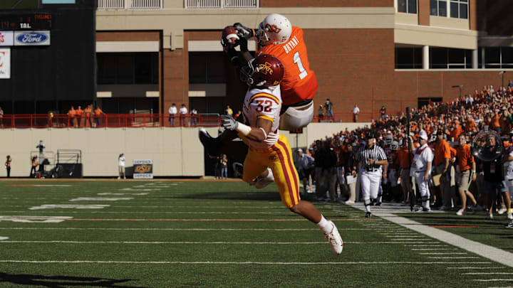 Oklahoma State Cowboys wide receiver Dez Bryant catches a touchdown over Iowa State Cyclones defensive back Ter'ran Benton.