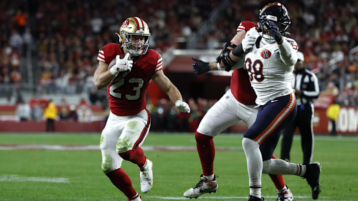 Dec 28, 2025; Santa Clara, California, USA; San Francisco 49ers running back Christian McCaffrey (23) runs for a touchdown against the Chicago Bears in the first half at Levi's Stadium. Mandatory Credit: Sergio Estrada-Imagn Images