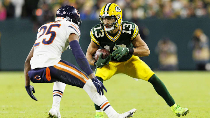 Dec 12, 2021; Green Bay, Wisconsin, USA;  Green Bay Packers wide receiver Allen Lazard (13) rushes with the football as Chicago Bears cornerback Artie Burns (25) defends during the fourth quarter at Lambeau Field. Mandatory Credit: Jeff Hanisch-Imagn Images