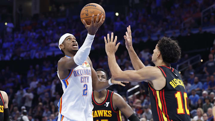 Oct 27, 2024; Oklahoma City, Oklahoma, USA; Oklahoma City Thunder guard Shai Gilgeous-Alexander (2) shoots against Atlanta Hawks forward Zaccharie Risacher (10) during the second half at Paycom Center. Mandatory Credit: Alonzo Adams-Imagn Images