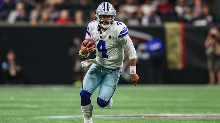 Dallas Cowboys quarterback Dak Prescott scrambles against the Atlanta Falcons in the third quarter at Mercedes-Benz Stadium. 