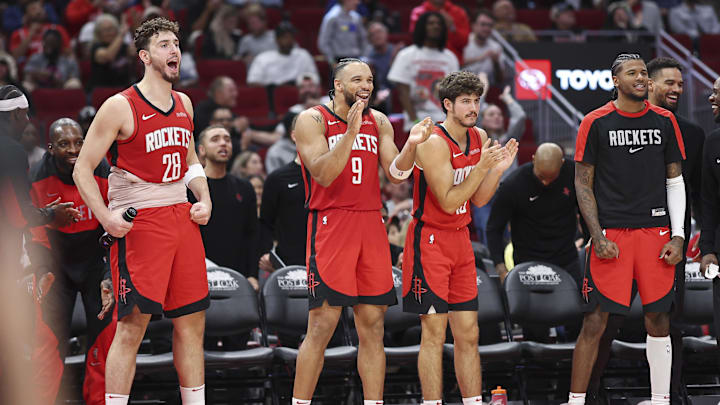 Oct 25, 2024; Houston, Texas, USA; Houston Rockets center Alperen Sengun (28) and forward Dillon Brooks (9) and guard Reed Sheppard (15) and guard Jalen Green (4) react from the bench after a play during the fourth quarter against the Memphis Grizzlies at Toyota Center. Mandatory Credit: Troy Taormina-Imagn Images