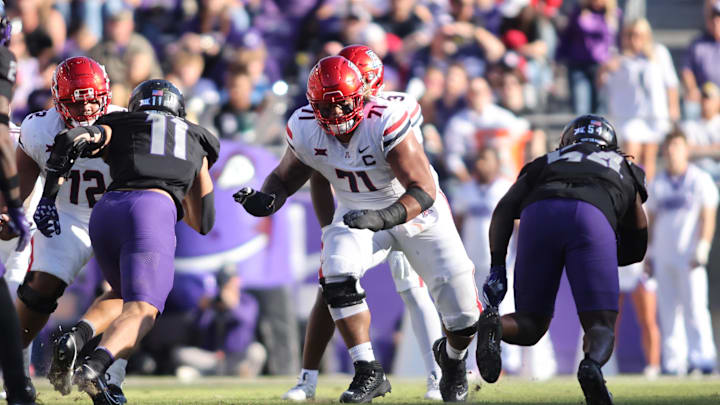 Nov 23, 2024; Fort Worth, Texas, USA; Arizona Wildcats offensive lineman Jonah Savaiinaea (71) blocks in the second quarter against the TCU Horned Frogs at Amon G. Carter Stadium. Mandatory Credit: Tim Heitman-Imagn Images