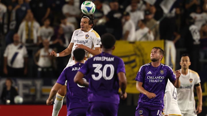 Mar 29, 2025; Carson, California, USA;  LA Galaxy forward Miguel Berry (27) heads the ball during the second half against Orlando City at Dignity Health Sports Park. Mandatory Credit: Kiyoshi Mio-Imagn Images