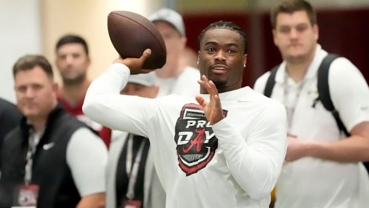 Mar 19, 2025; Tuscaloosa AL, USA; Quarterback Jalen Milroe throws for scouts at the University of Alabama Pro Day as several Crimson Tide players worked out for NFL teams in the Hank Crisp Indoor Practice Facility.
