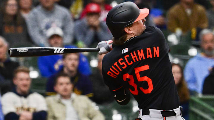 May 21, 2025; Milwaukee, Wisconsin, USA; Baltimore Orioles catcher Adley Rutschman (35) hits a 3-run home run in the eleventh inning against the Milwaukee Brewers at American Family Field.