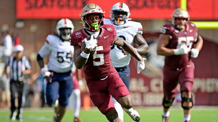Oct 3, 2026; Tallahassee, Florida, USA; Florida State Seminoles running back Quintrevion Wisner (5) runs the ball against the Virginia Cavaliers during the second half at Doak S. Campbell Stadium. Mandatory Credit: Melina Myers-Imagn Images Oct 3, 2026; Tallahassee, Florida, USA; Florida State Seminoles running back Quintrevion Wisner (5) runs the ball against the Virginia Cavaliers during the second half at Doak S. Campbell Stadium. Mandatory Credit: Melina Myers-Imagn Images