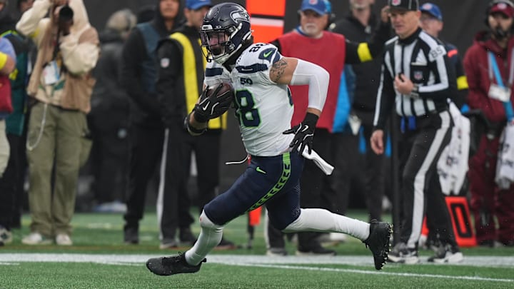 Seattle Seahawks tight end AJ Barner (88) makes a catch and heads to the end zone against the Carolina Panthers.