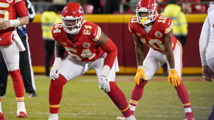 Dec 31, 2023; Kansas City, Missouri, USA; Kansas City Chiefs offensive tackle Wanya Morris (64) and running back Isiah Pacheco (10) at the line of scrimmage against the Cincinnati Bengals during the game at GEHA Field at Arrowhead Stadium. Mandatory Credit: Denny Medley-USA TODAY Sports
