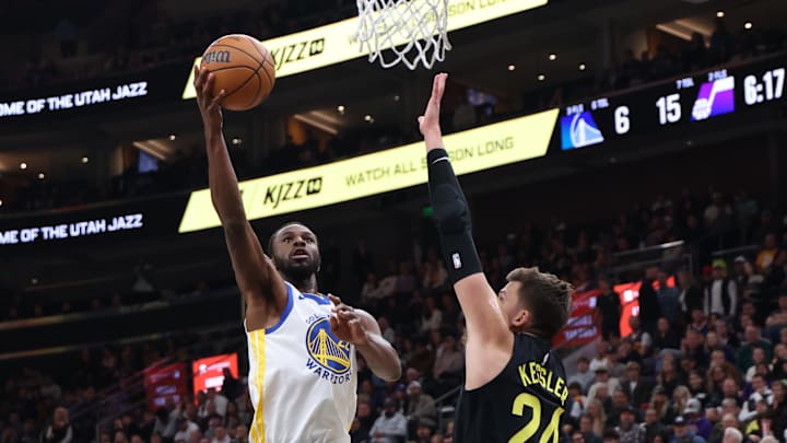 Oct 25, 2024; Salt Lake City, Utah, USA; Golden State Warriors forward Andrew Wiggins (22) goes to the basket against Utah Jazz center Walker Kessler (24) during the first quarter at Delta Center. Mandatory Credit: Rob Gray-Imagn Images Oct 25, 2024; Salt Lake City, Utah, USA; Golden State Warriors forward Andrew Wiggins (22) goes to the basket against Utah Jazz center Walker Kessler (24) during the first quarter at Delta Center. Mandatory Credit: Rob Gray-Imagn Images