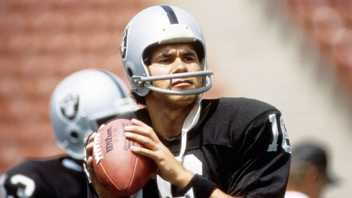 Aug 1984; Los Angeles, CA, USA: FILE PHOTO;  Los Angeles Raiders quarterback Jim Plunkett during the 1986 season at the Los Angeles Memorial Coliseum.  Mandatory Credit: Imagn Images