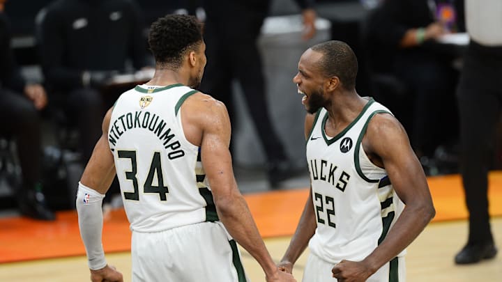 Milwaukee Bucks forward Khris Middleton celebrates with Giannis Antetokounmpo.