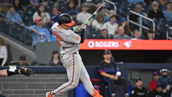 Aug 8, 2024; Toronto, Ontario, CAN; Baltimore Orioles first base Ryan Mountcastle (6) hits an infield single in the ninth inning against the Toronto Blue Jays at Rogers Centre. 