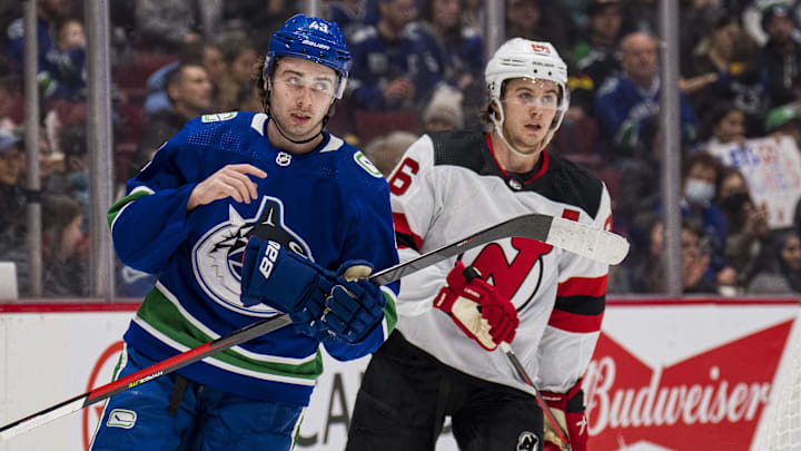 Vancouver Canucks defenseman Quinn Hughes shares laugh with his brother New Jersey Devils forward Jack Hughes.