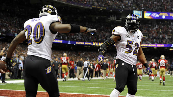 Feb 3, 2013; New Orleans, LA, USA; Baltimore Ravens inside linebacker Ray Lewis (52) celebrates with free safety Ed Reed (20) after the San Francisco 49ers failed to convert on fourth down in the fourth quarter in Super Bowl XLVII at the Mercedes-Benz Superdome. Mandatory Credit: Robert Deutsch-Imagn Images