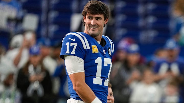 Indianapolis Colts quarterback Daniel Jones (17) smiles while talking to teammates on Sunday, Oct. 26, 2025, ahead of the game at Lucas Oil Stadium in Indianapolis.