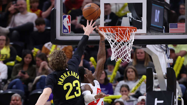 Jan 12, 2024; Salt Lake City, Utah, USA; Toronto Raptors guard RJ Barrett (9) goes to the basket against Utah Jazz forward Lauri Markkanen (23) during the second quarter at Delta Center. Mandatory Credit: Rob Gray-Imagn Images